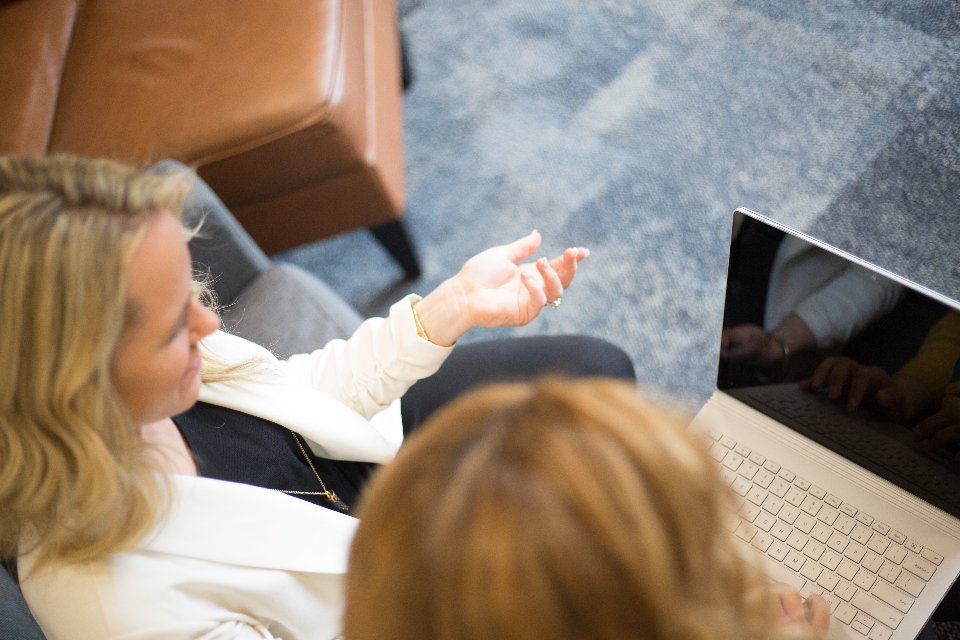 Colleagues in a collaborative discussion about business requirements